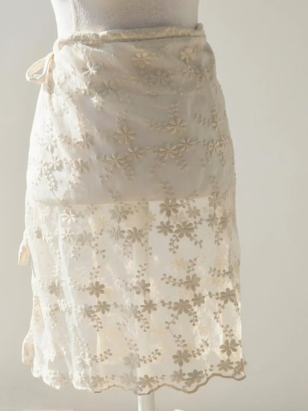 Y2k 2000s style white lace wrap skirt with floral embroidery and tie waist